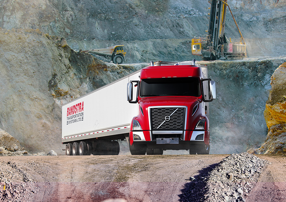 Bandstra tractor trailer driving through BC mining project site