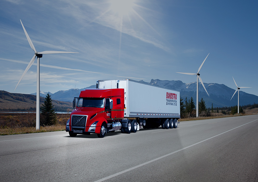 Bandstra highway truck driving by windmills and BC landscape