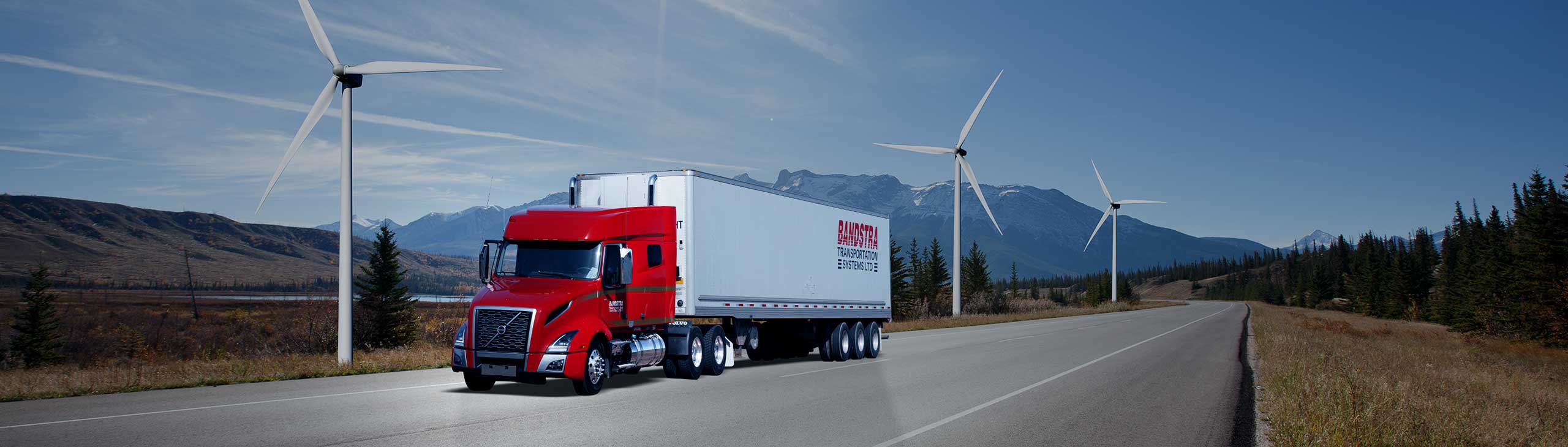 Bandstra highway truck driving by windmills and BC landscape