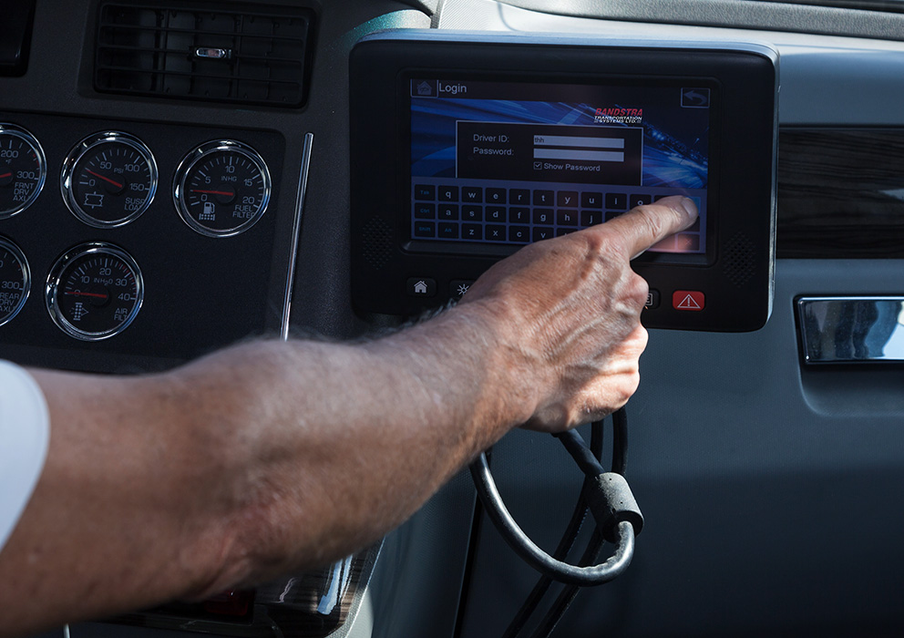 Bandstra driver using Electronic Log Device on dashboard