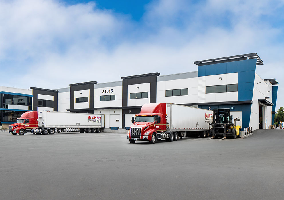 Bandstra trucks backed into cross docking stations at terminal